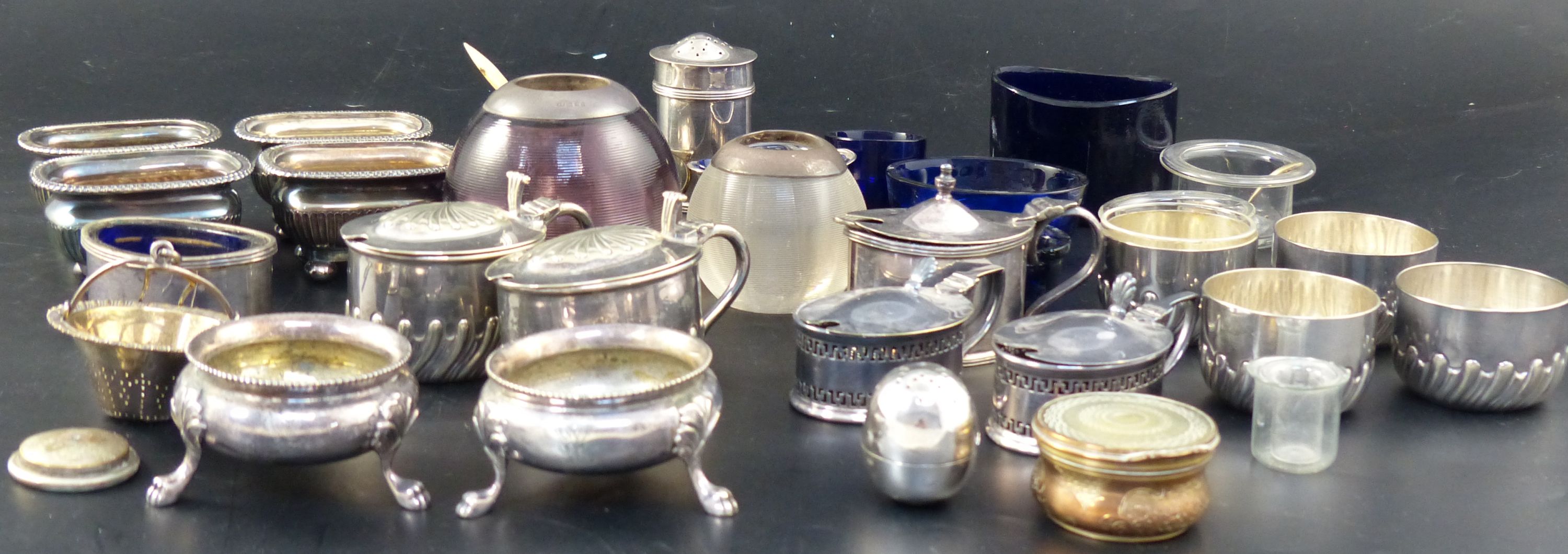 A group of assorted plated condiments, two silver condiments, a silver strainer two match tidies, etc.